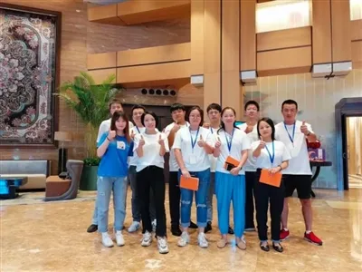 Group Photo Of The Company Team And Customers